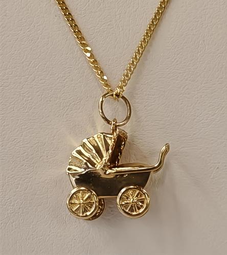 Kultainen maskottiriipus lastenvaunut