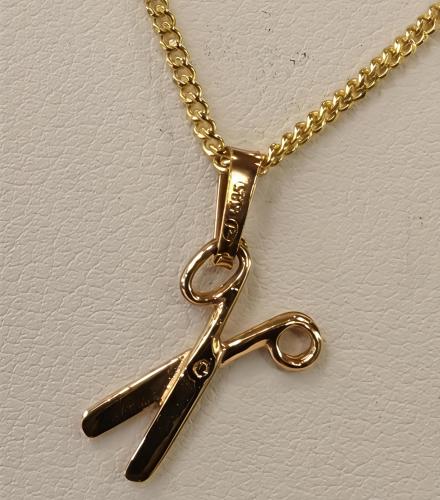 Kultainen maskottiriipus sakset