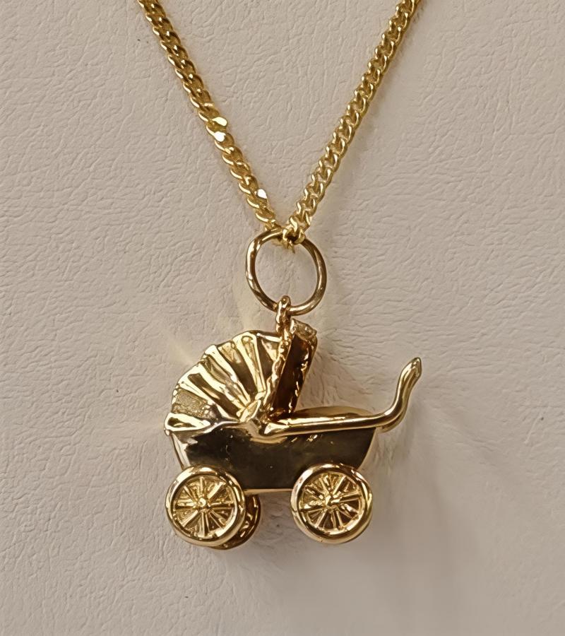 Kultainen maskottiriipus lastenvaunut