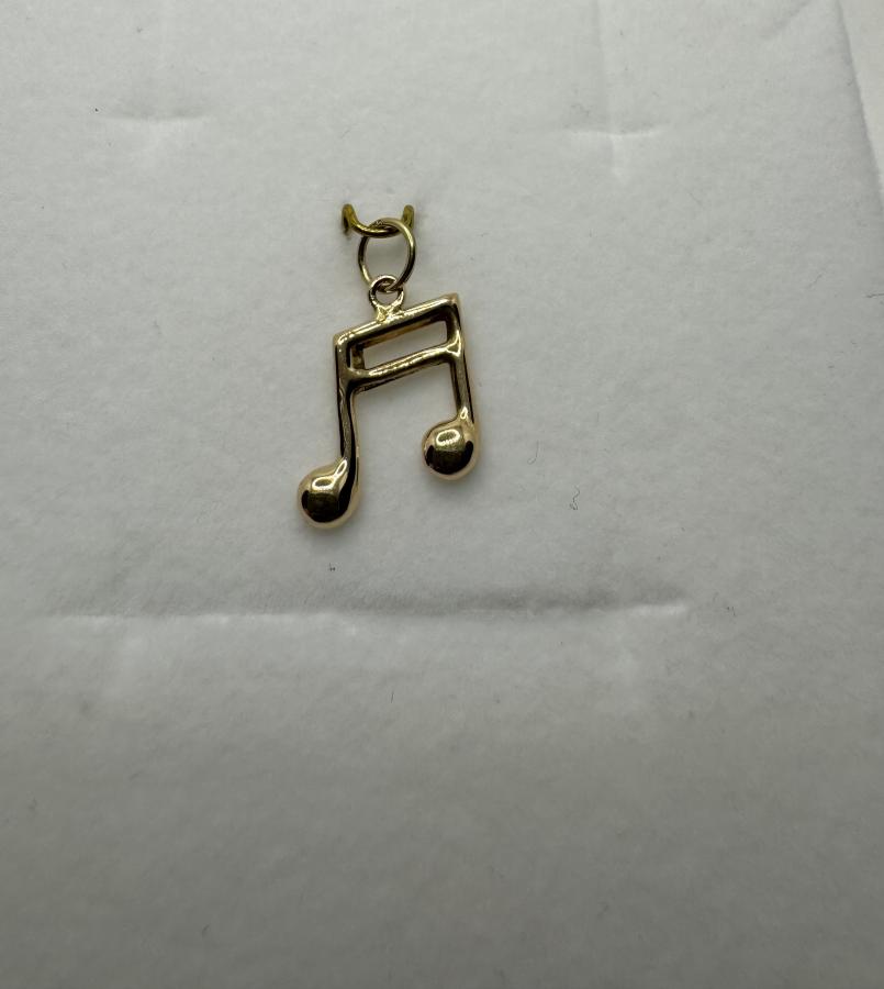 Kultainen maskottiriipus nuotti