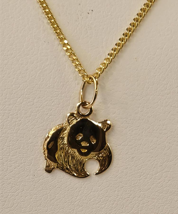 Kultainen maskottiriipus karhu