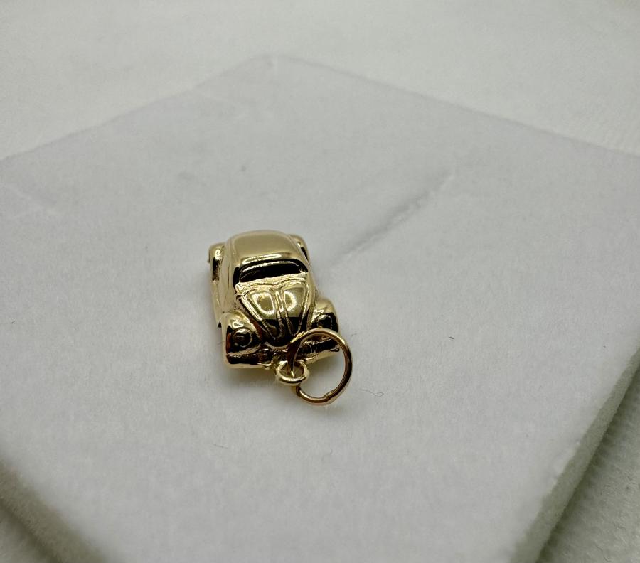 Kultainen maskottiriipus kuplavolkkari