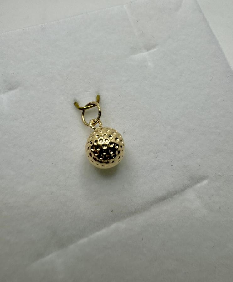 Kultainen maskottiriipus golfpallo