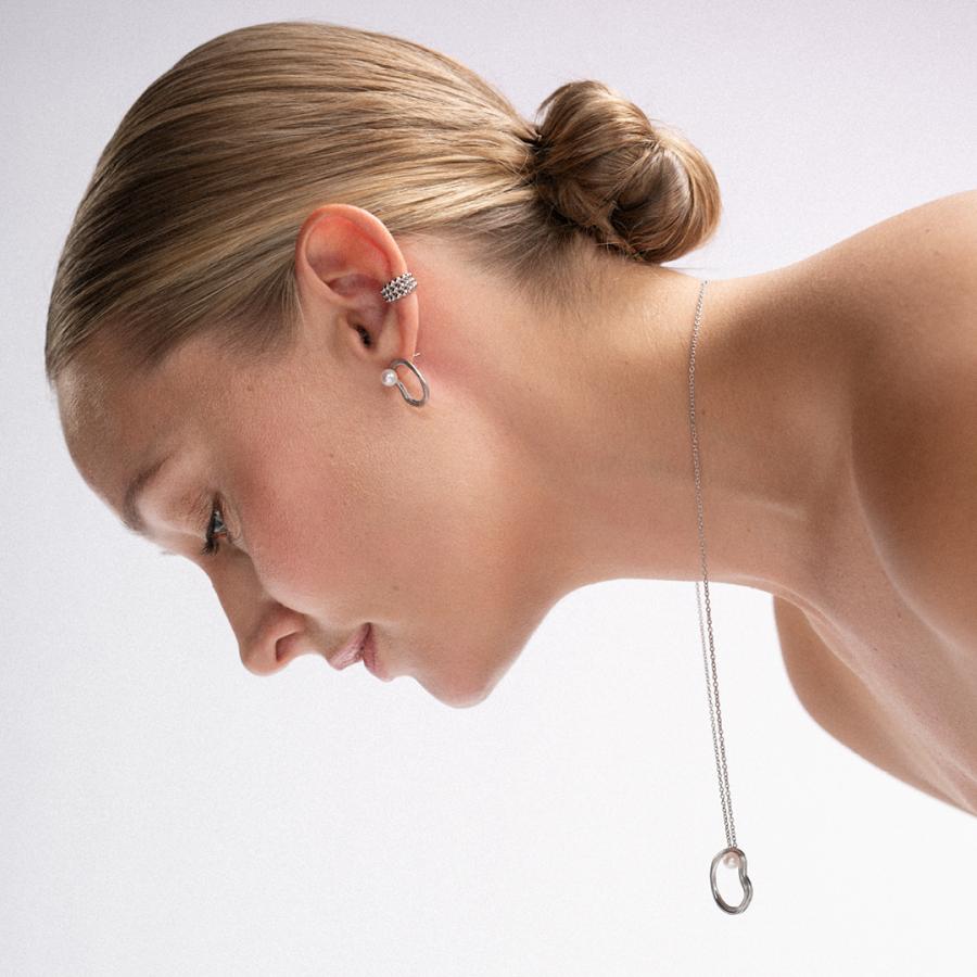 Lumoava UOMA -korvakorut, hopeaa